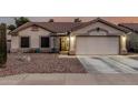 Beautiful single-story home featuring a well-maintained front yard with desert landscaping at 11361 E Escondido Ave, Mesa, AZ 85208