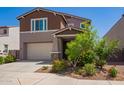 Charming two-story home with a two-car garage, craftsman architecture, and nicely landscaped front yard at 12041 W Fillmore St, Avondale, AZ 85323