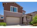 Charming two-story home with a two-car garage, craftsman architecture, and nicely landscaped front yard at 12041 W Fillmore St, Avondale, AZ 85323