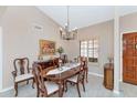 Formal dining room with elegant chandelier, table set for six, and tasteful decor at 12730 N 90Th Way, Scottsdale, AZ 85260