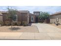 Charming single-story home featuring a well-kept yard and a spacious driveway for easy parking at 14841 W Desert Hills Dr, Surprise, AZ 85379