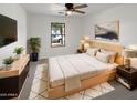 Inviting main bedroom featuring neutral tones, contemporary furnishings, and a calming atmosphere for relaxation at 18148 W Lundberg St, Surprise, AZ 85388
