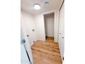 Laundry room with light wood flooring, utility hookups, and closet at 225 N Standage -- # 45, Mesa, AZ 85201