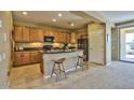 Charming kitchen with a breakfast bar and seamless transition to the living area at 23317 N Arrellaga Dr, Sun City West, AZ 85375