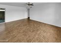 Open-concept living room with hardwood floors, providing a versatile living space at 2614 E Obregon St, Tempe, AZ 85288