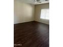 Spacious bedroom with wood floors, a ceiling fan, and bright natural light at 33055 N Madison Way Dr, San Tan Valley, AZ 85144