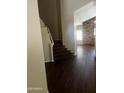 A staircase with wood floors is shown and leads to the upper level at 33055 N Madison Way Dr, San Tan Valley, AZ 85144