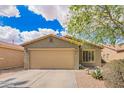 Charming single-story home with a two-car garage and low-maintenance desert landscaping at 44976 W Miramar Rd, Maricopa, AZ 85139