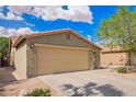 Charming single-story home with a two-car garage and low-maintenance desert landscaping at 44976 W Miramar Rd, Maricopa, AZ 85139