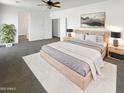 Serene main bedroom features soft lighting, a cozy rug, and stylish contemporary furniture at 5140 W Bent Tree Dr, Phoenix, AZ 85083