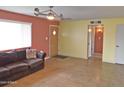 Open living room featuring a ceiling fan and plentiful natural light at 1019 E Granada Ave, Apache Junction, AZ 85119