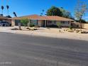 Inviting single-level house with a charming front yard, complemented by low-maintenance landscaping at 1160 W Ivanhoe St, Chandler, AZ 85224