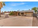 Inviting single-level home with a charming front porch and ample parking space at 1179 E Cordova Ave, Casa Grande, AZ 85122