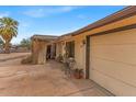 Close up shot of a home exterior with a charming porch and attached garage at 1179 E Cordova Ave, Casa Grande, AZ 85122