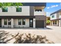 Modern townhome exterior with sleek lines, private garage, and inviting curb appeal in a desirable location at 3010 N 37Th St # 6, Phoenix, AZ 85018