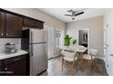 Eat-in kitchen featuring stainless steel appliances, granite countertops, and a dining area with great natural light at 3010 N 37Th St # 6, Phoenix, AZ 85018
