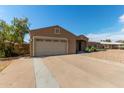 Attractive single-Gathering house with low-maintenance desert landscaping, long driveway, and attached garage at 3034 E Turney Ave, Phoenix, AZ 85016