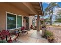 Cozy front porch with a seating area, plants, and decorative accents at 317 E Harwell Rd, Gilbert, AZ 85234