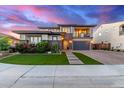 Stunning two-story home featuring a two-car garage, manicured lawn, and charming front entryway at 3408 E Daley Ln, Phoenix, AZ 85050