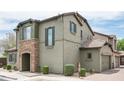 Charming home features a stone-accented entry, complemented by neutral tones and neat landscaping, creating inviting curb appeal at 3983 E Melinda Dr, Phoenix, AZ 85050