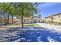 This inviting two-story home boasts a spacious driveway, manicured lawn, and lush trees at 4609 E Ironhorse Rd, Gilbert, AZ 85297
