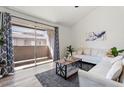 Bright living room with sliding glass doors leading to an outdoor balcony at 623 W Guadalupe Rd # 288, Mesa, AZ 85210