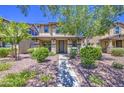 Inviting two-story home with a desert landscape front yard at 935 S Deerfield Ln, Gilbert, AZ 85296