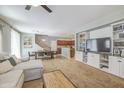 Open-concept living space with built-in shelving and a neutral color palette at 935 S Deerfield Ln, Gilbert, AZ 85296