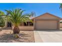 Charming single-story home featuring desert landscaping and an attached two-car garage at 9857 W Tonto Ln, Peoria, AZ 85382