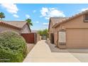 Long driveway on side of house leading to backyard at 10341 E Dragoon Ave, Mesa, AZ 85208