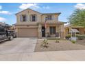 Charming two-story home with a two car garage and a cozy front porch at 17935 W Louise Dr, Surprise, AZ 85387