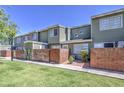 Charming townhouse with well-maintained landscaping, a brick wall, and a private entrance providing a cozy feel at 2301 E University Dr # 488, Mesa, AZ 85213