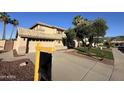 Inviting two-story home with manicured lawn, desert landscaping, tile roof, and bright natural light at 2549 E Desert Trumpet Rd, Phoenix, AZ 85048