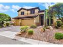 Charming two-story home with a three-car garage and well-maintained desert landscaping at 2758 N Sterling --, Mesa, AZ 85207