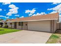Attractive one-story home with a convenient two-car garage and a neatly landscaped front yard at 3814 W El Camino Dr, Phoenix, AZ 85051
