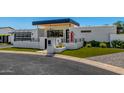 Contemporary home showcasing sleek architecture, modern mailbox, and green lawn at 5822 N 44Th Pl, Phoenix, AZ 85018
