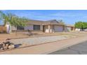 A well-maintained house featuring desert landscaping, a quaint entrance, and a spacious two-car garage at 6926 W Comet Ave, Peoria, AZ 85345