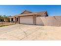 Spacious two-car garage with a wide driveway providing ample parking space at 6926 W Comet Ave, Peoria, AZ 85345