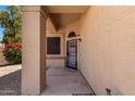 Inviting front porch with security door and neutral color scheme at 7702 W Piute Ave, Glendale, AZ 85308