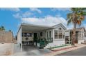 Charming home with a covered carport, landscaped yard, and welcoming curb appeal at 838 Aquamarine Dr, Apache Junction, AZ 85119