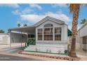 Charming home with a covered carport, landscaped yard, and welcoming curb appeal at 838 Aquamarine Dr, Apache Junction, AZ 85119
