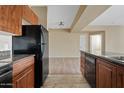 Kitchen features wood cabinets and stone countertops at 10136 E Southern Ave # 1052, Mesa, AZ 85209