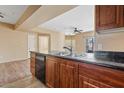 Kitchen sink with a view of the open concept living room at 10136 E Southern Ave # 1052, Mesa, AZ 85209