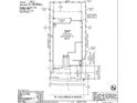 Site plan of a home, featuring an outdoor living area, a driveway, a porch, and a three-car garage at 10155 W Columbus Ave, Avondale, AZ 85392