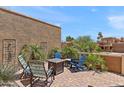 Open patio features a cozy seating area with a fire pit and desert landscaping at 10838 N 10Th St, Phoenix, AZ 85020