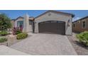 Beautiful home featuring a spacious driveway with a two-car garage and well-maintained landscaping at 116 E Santa Lucia Ln, Queen Creek, AZ 85140