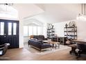 Open-concept living room featuring vaulted ceilings, tile floors, and a dining area at 19276 N 90Th Pl, Scottsdale, AZ 85255