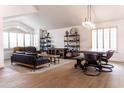 Open-concept living room with vaulted ceilings, stylish furnishings, and ample natural light at 19276 N 90Th Pl, Scottsdale, AZ 85255