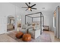 Bright main bedroom with modern decor, a canopy bed, and view to a sitting area at 2239 N Calvin --, Mesa, AZ 85207