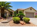 Charming single story with desert landscaping, featuring a walkway to the entryway at 3166 N 158Th Ave, Goodyear, AZ 85395